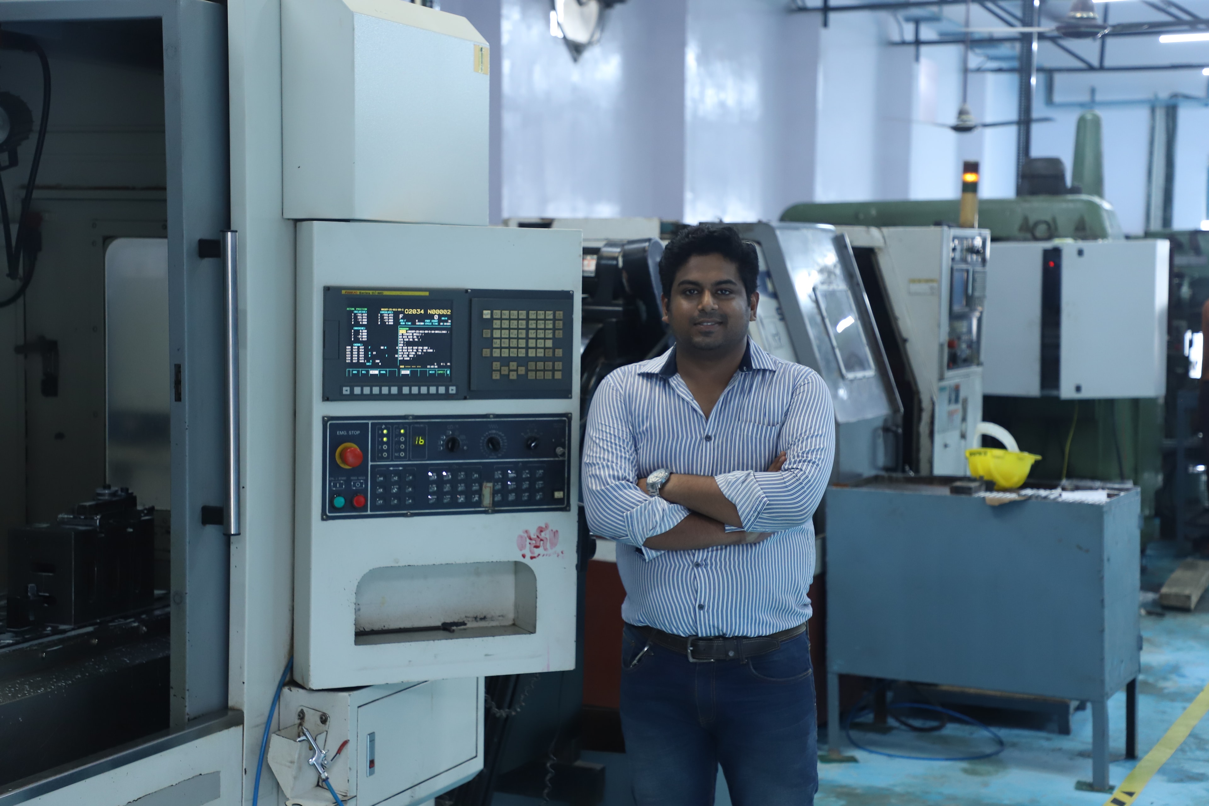 Aariv Precision founder at CNC machine